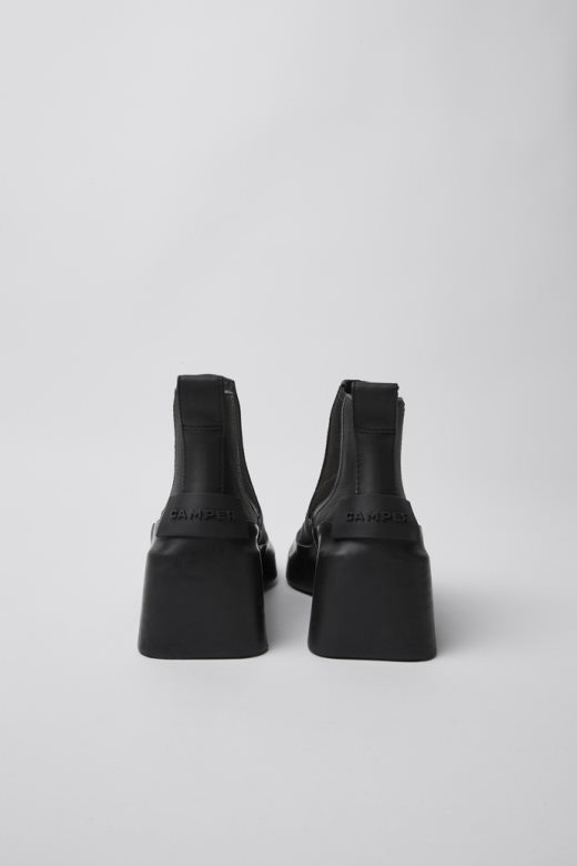 дизајн кишне црне кожне глежњаче са штиклама кампер