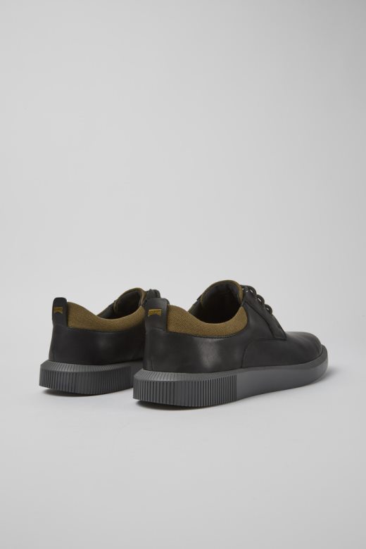 дизајн рачун црне кожне ципеле на везице кампер